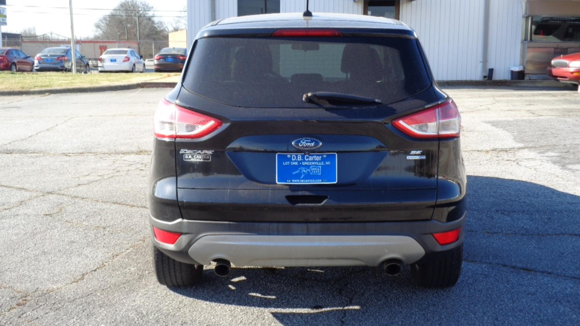 2014 BLACK /TAN Ford Escape SE 4WD (1FMCU9GX0EU) with an 1.6L L4 DOHC 16V engine, 6-Speed Automatic transmission, located at 2812 White Horse Road, Greenville, SC, 29611, (864) 269-1711, 34.808655, -82.434776 - Photo#4