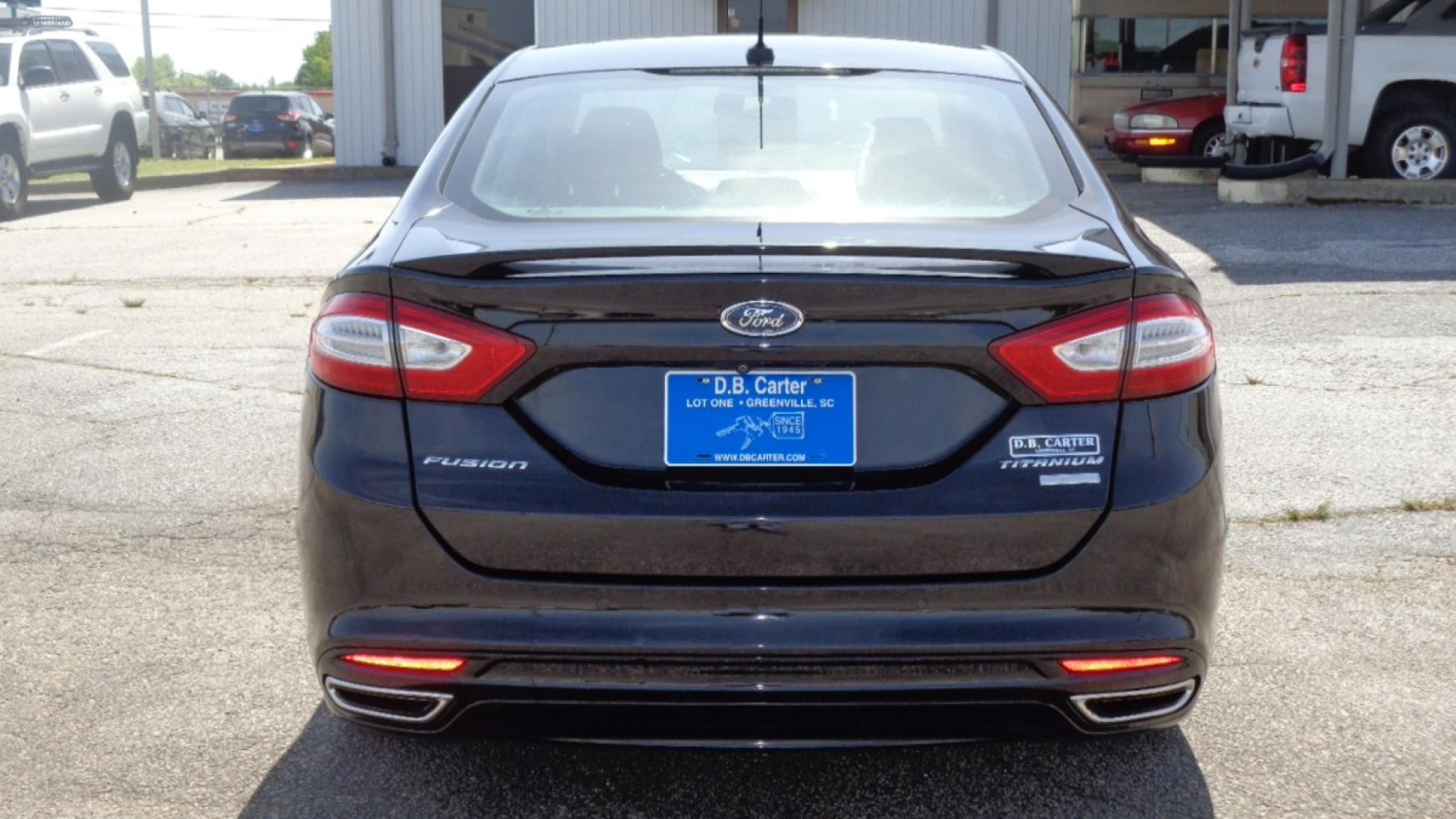 2016 BLACK /BLACK Ford Fusion Titanium (3FA6P0K99GR) with an 2.0L L4 DOHC 16V engine, 6-Speed Automatic transmission, located at 2812 White Horse Road, Greenville, SC, 29611, (864) 269-1711, 34.808655, -82.434776 - 3.6 LITER V6 ENGINE, 22 INCH BLACK RIMS W/ NEW SET OF TIRES,ANTI LOCK BRAKES,TILT/REACH STEERING,A/C,DUAL AIRBAGS,FRONT SIDE AIRBAGS,BODY COLOR BUMPERS,MIRRORS,AND DOOR HANDLES,CRUISE CONTROL, FOG LIGHTS ,AUTOMATIC HEADLIGHTS,USB/AUX OUTLET,VANITY MIRRORS,TRACTION COTNROL,POWER MIRRORS,WINDOWS,AND D - Photo#4